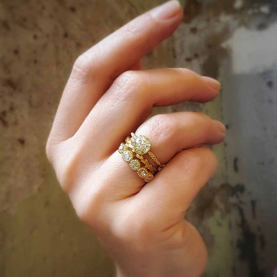 Handmade wedding band with lace inspired picot bezel set old mine cut and old European cut diamonds in 18K yellow gold by Designer Megan Thorne