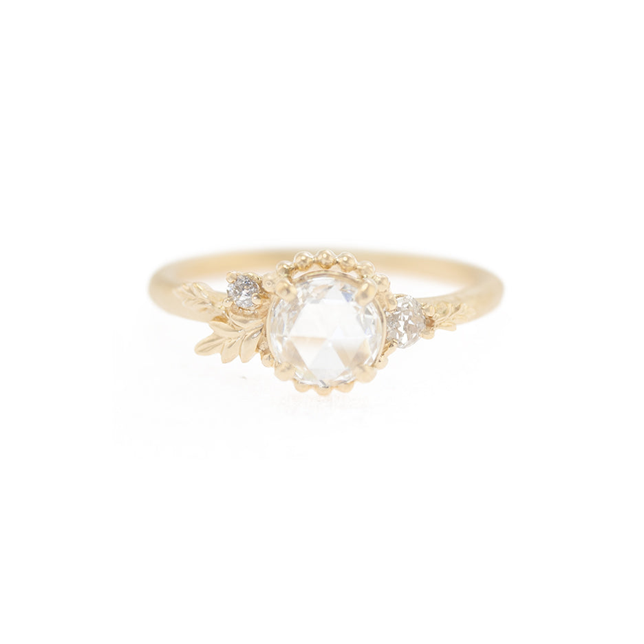 Handmade classic engagement ring featuring VVS1 color D rose cut diamond and diamond accents with floral Wood Nymph details in 18K yellow gold by Designer Megan Thorne