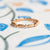 Handmade wedding or stacking band with diamonds and botanical Evergreen details in 18K rose gold by Designer Megan Thorne