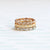 Handmade wedding band with ribbing and cut outs and diamonds in 18K white gold by Designer Megan Thorne 