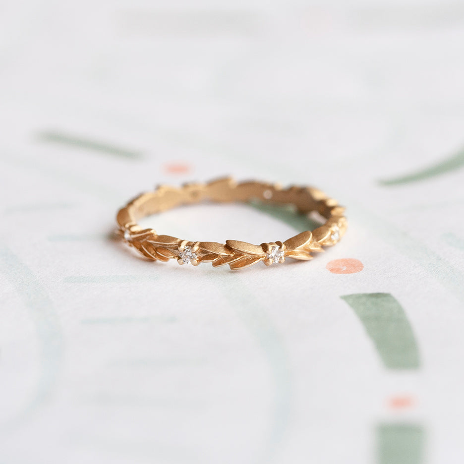Handmade floral botanical inspired wedding or stacking band with diamonds hand carved in 18K yellow gold by Designer Megan Thorne