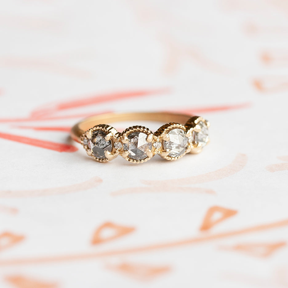 Handmade wedding or stacking band with salt and pepper rose cut diamonds and brilliant cut accents with ribbed details in 18K yellow gold by Designer Megan Thorne