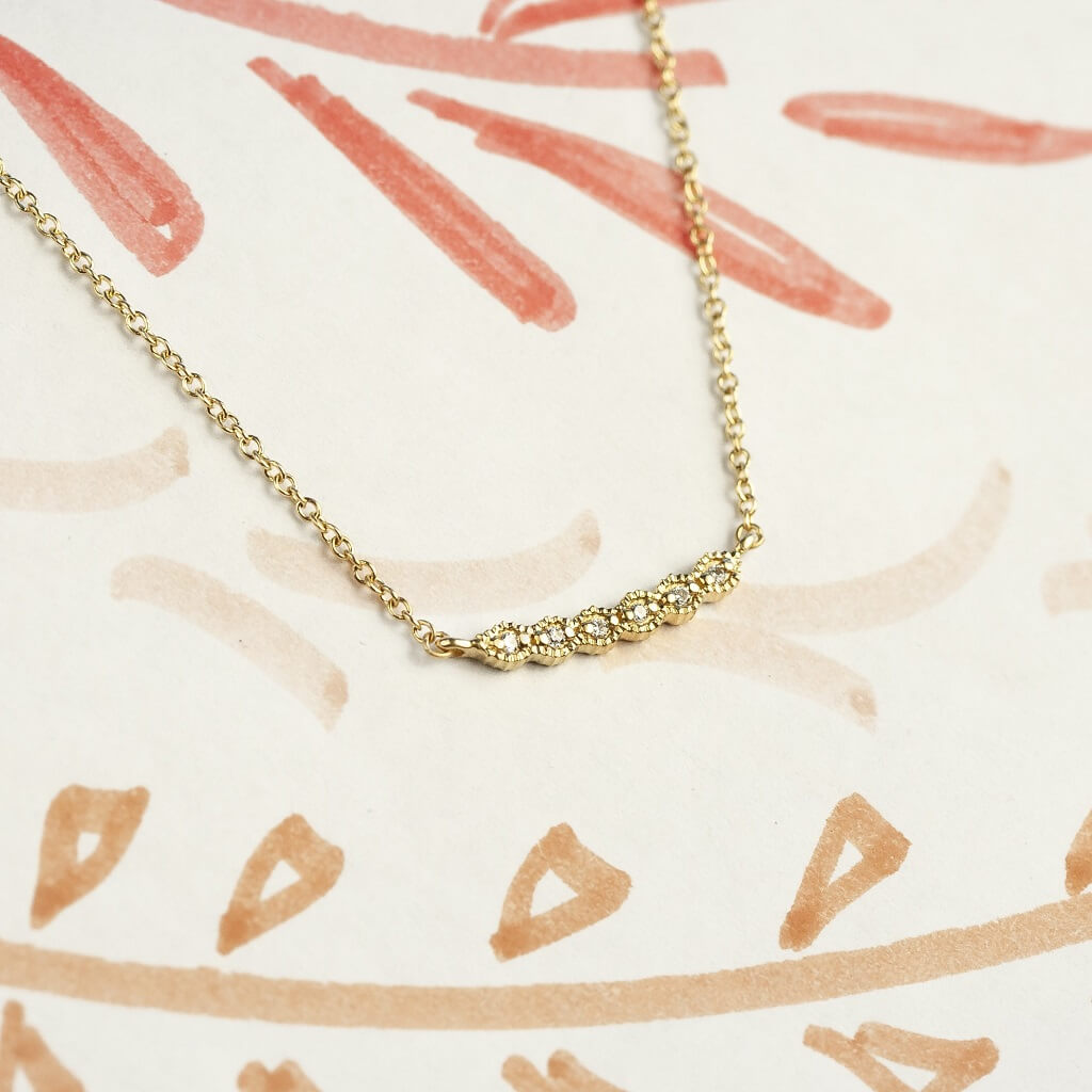 Handmade diamond necklace with vintage inspired ribbing in 18K yellow gold by Designer Megan Thorne