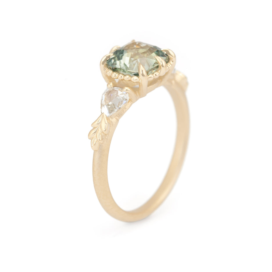 Sapphire Engagement Ring in Yellow Gold with Botanical Detailing Through Finger View