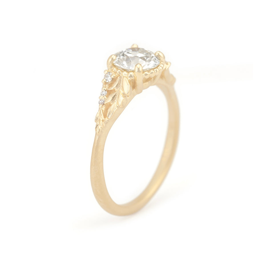 Old Euro Cut Diamond Engagement Ring in Yellow Gold with Botanical Detailing Through Finger View