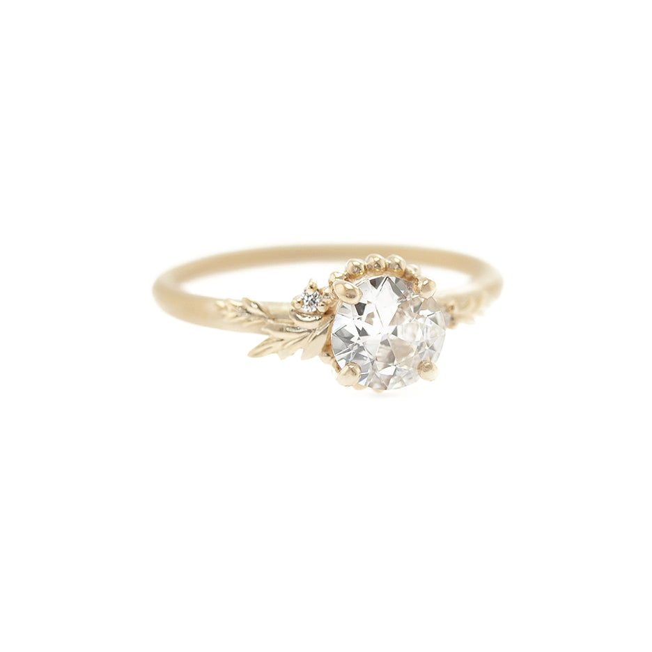 Handmade engagement ring with .66ct old European cut diamond and floral details in 18K yellow gold by Designer Megan Thorne