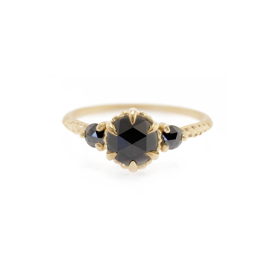 Handmade alternative engagement or statement ring with black rose cut diamonds and botanical Evergreen details in 18K yellow gold by Designer Megan Thorne