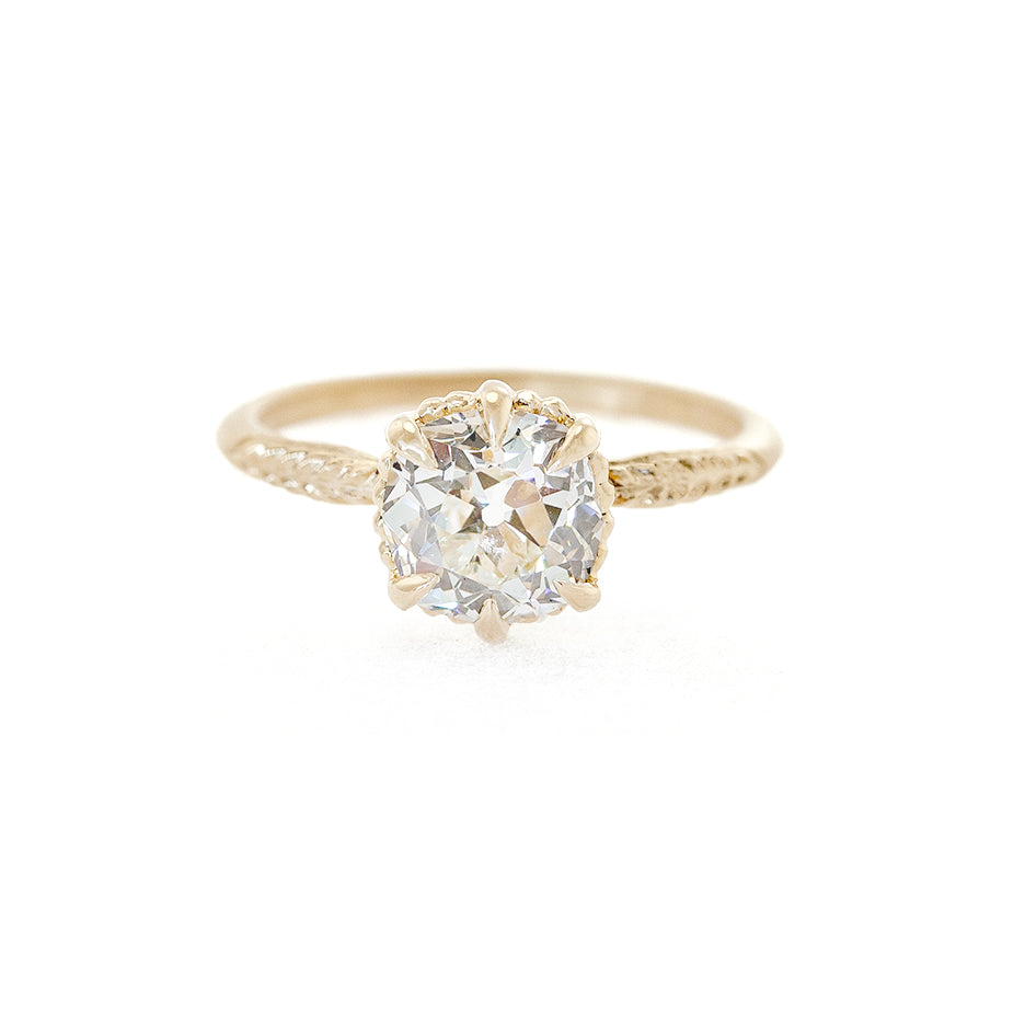 Handmade solitaire engagement ring featuring 1.64ct antique old mine cut diamond with botanical details in 18K yellow gold by Designer Megan Thorne