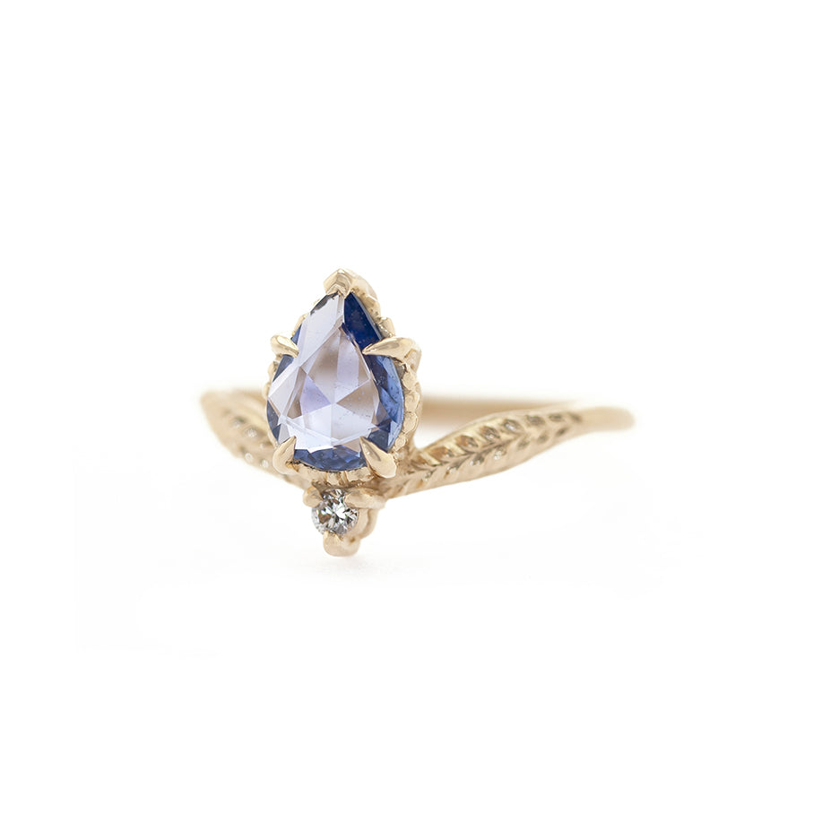 Handmade engagement ring with blue sapphire and accent diamond in 18K yellow gold by Designer Megan Thorne