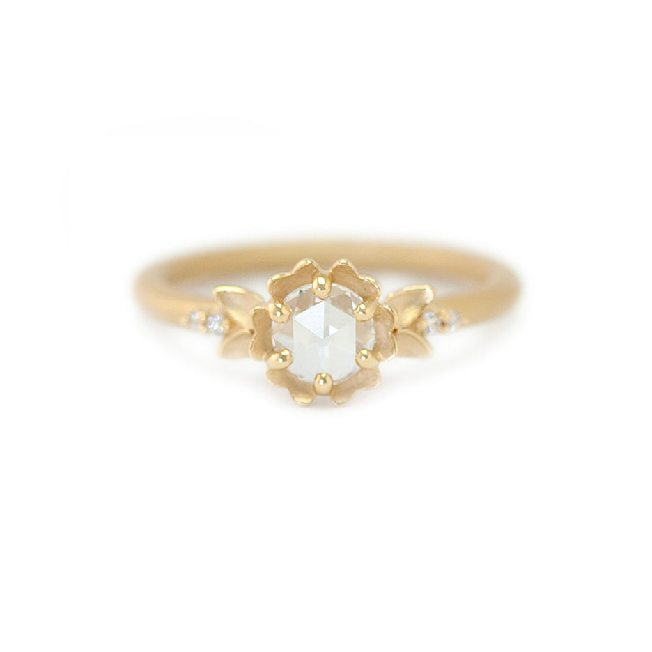 Handmade floral engagement ring with rose cut diamond center stone and delicate diamond accents in 18K yellow gold by Designer Megan Thorne