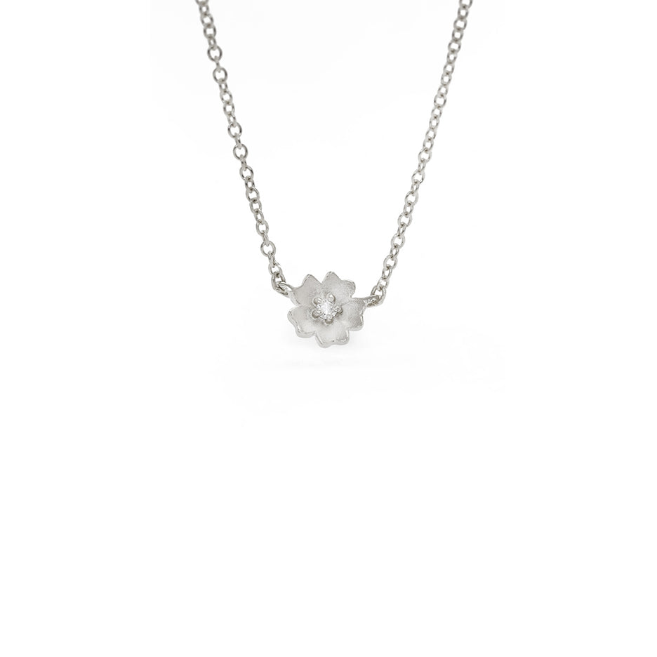 Handmade floral necklace with Buttercup flower with diamond in 18K white gold by Designer Megan Thorne