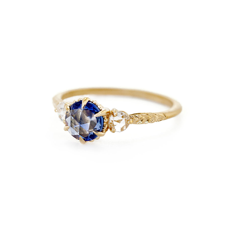 Handmade 3-stone engagement ring with rose cut blue sapphire and rose cut diamonds in 18K yellow gold by Designer Megan Thorne