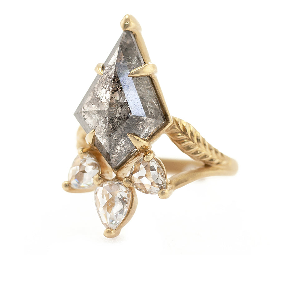 Handmade statement engagement ring with fancy kite shaped salt and pepper diamond and rose cut pear diamond accents split shank with botanical Evergreen details in 18K yellow gold by Designer Megan Thorne