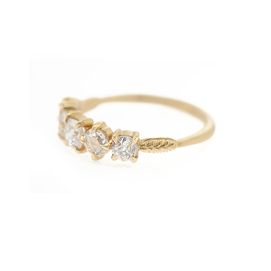 Handmade wedding and stacking band with antique diamonds and botanical inspired details in 18K yellow gold by designer Megan Thorne