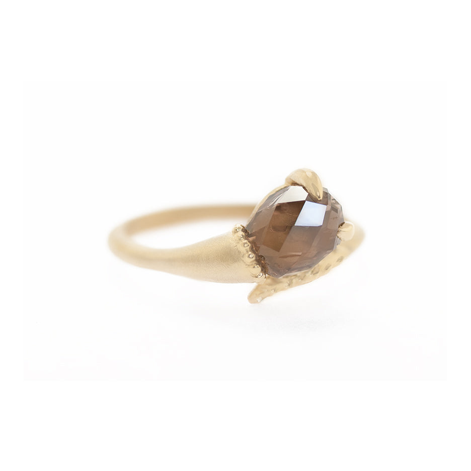 Handmade alternative engagement ring featuring unique richly colored brown briolette diamond and botanical Evergreen details in 18K yellow gold by Designer Megan Thorne