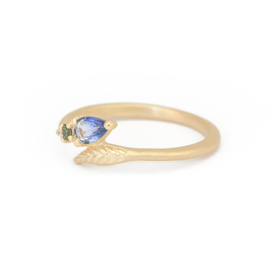 Blue Sapphire Ring in Yellow Gold with Botanical Detailing Three Quarter View