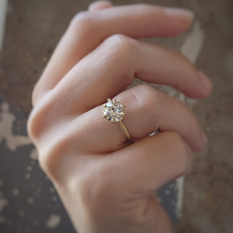 Solitaire with diamonds around it Outlet