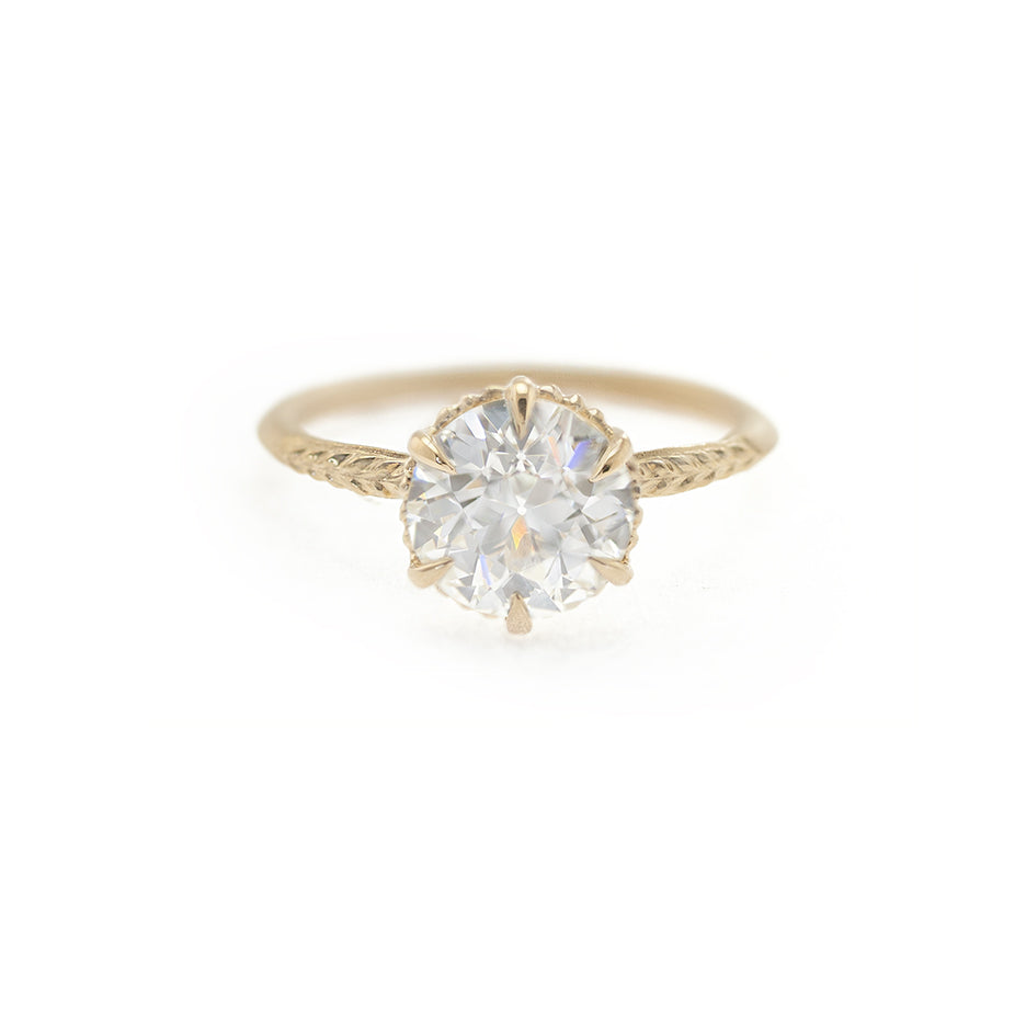 Handmade vintage inspired solitaire engagement ring featuring 1.87ct antique old European cut diamond and botanical Evergreen details in 18K yellow gold by Designer Megan Thorne