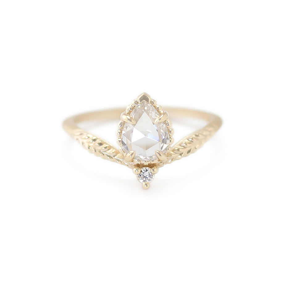 Handmade engagement ring with rose cut pear diamond and accent diamond in 18K yellow gold by Designer Megan Thorne