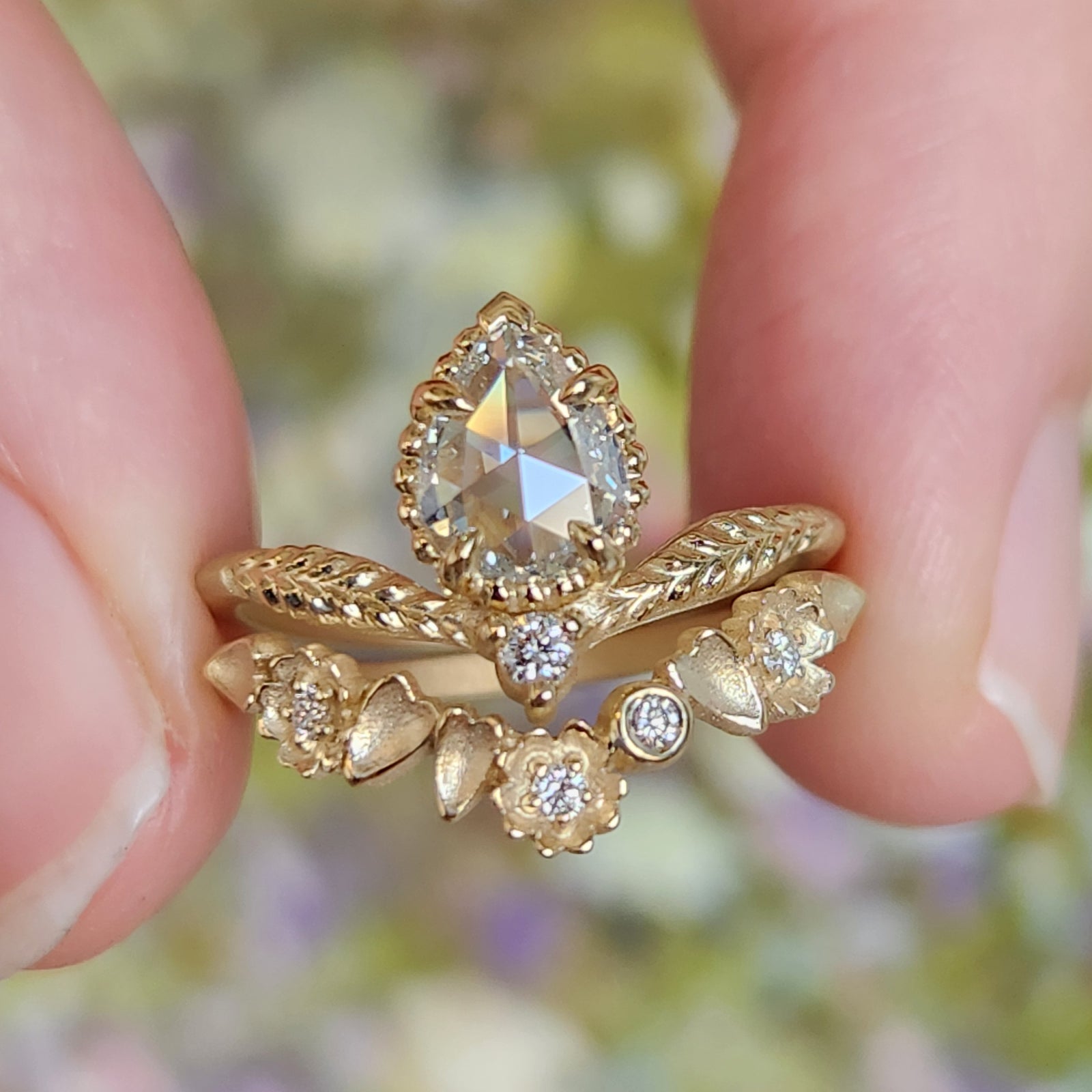 Handmade engagement ring with rose cut pear diamond and accent diamond in 18K yellow gold by Designer Megan Thorne