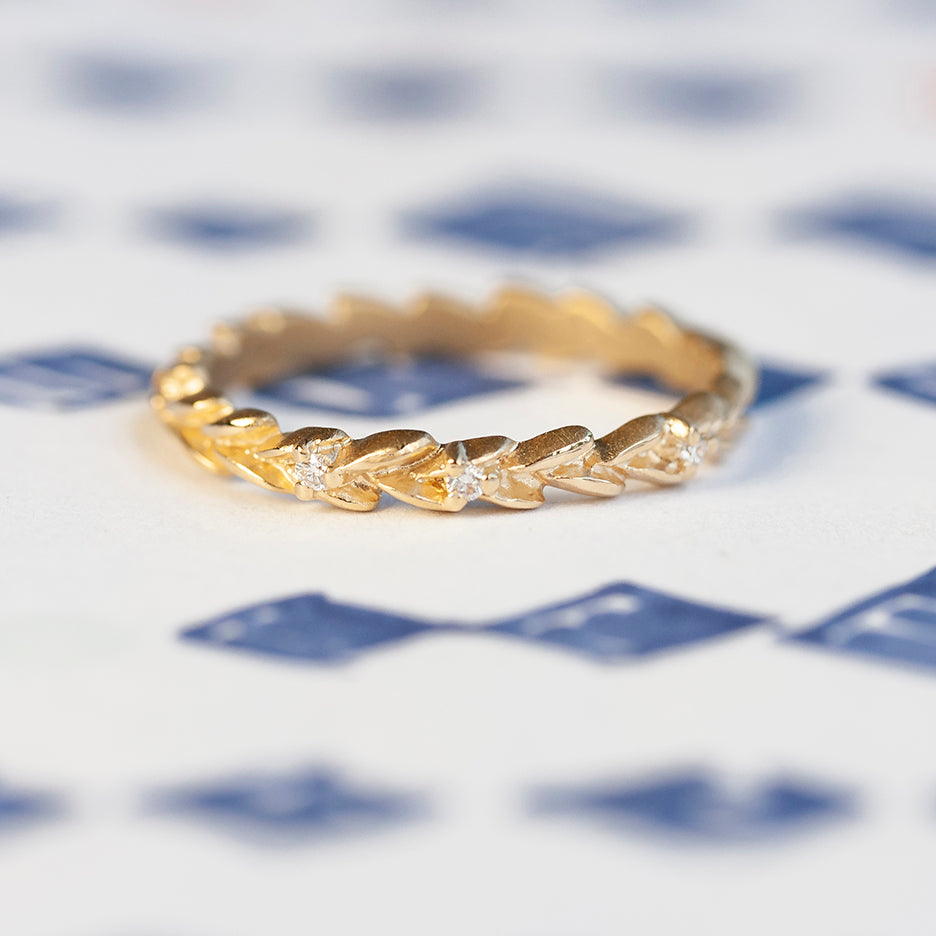 Handmade floral botanical inspired wedding or stacking band with diamonds hand carved in 18K yellow gold by Designer Megan Thorne