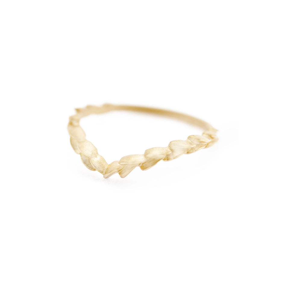 Handmade contour wedding band with floral Laurel Wreath details in a deep V to guard engagement ring in 18K yellow gold by Designer Megan Thorne