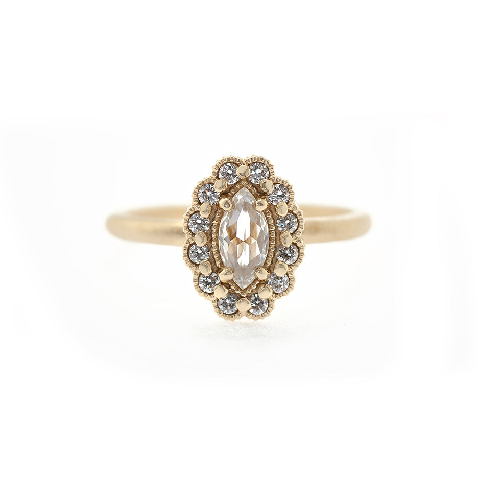 Handmade engagement ring with marquise rose cut diamond center and halo in 18K yellow gold by Designer Megan Thorne