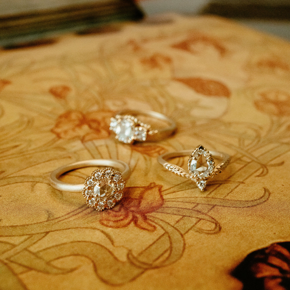 evergreen tulip handmade engagement ring with rose cut pear diamond and accent diamond in 18K yellow gold mosaic ring