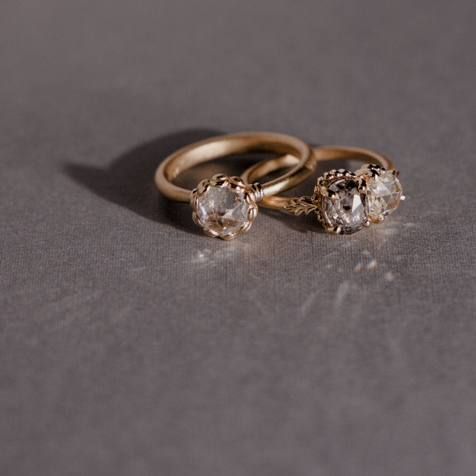 Rose Cut Diamond Ring in Yellow Gold with Detailing on Colored Background