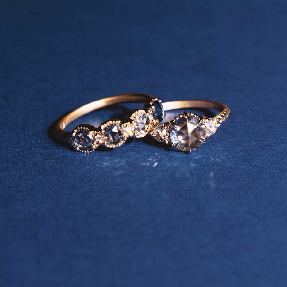 Handmade stacking wedding band or anniversary gift with rose cut blue sapphires and diamond accents with ribbing in 18K yellow gold by Designer Megan Thorne