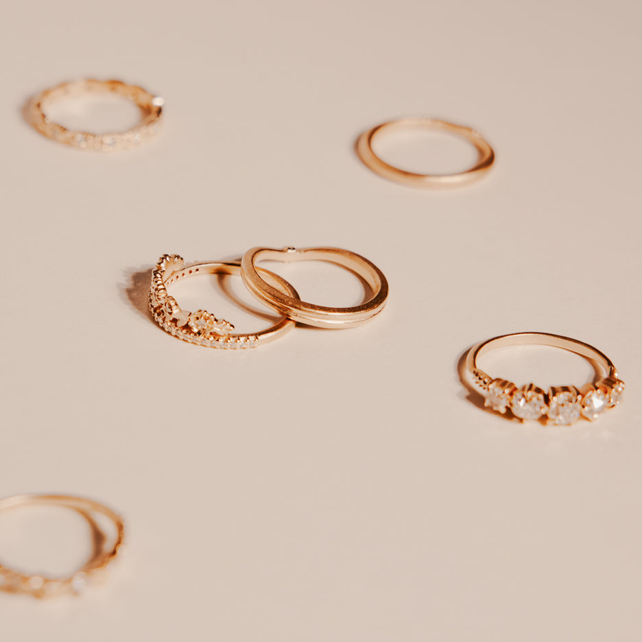 Wedding Band in Yellow Gold with Detailing Side on Colored Background