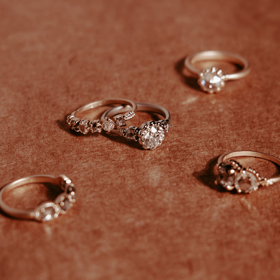 Diamond Engagement Ring in Yellow Gold with Detailing Front on Colored Background