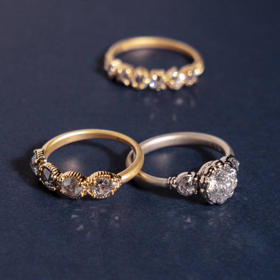 Antique Diamond Ring in White Gold with Detailing on Colored Background