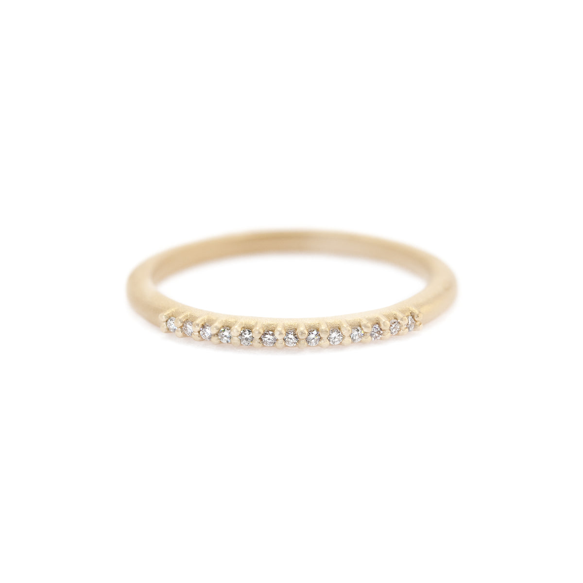 Handmade classic wedding band with pave set diamonds in 18K yellow gold. Perfect stacking band by Designer Megan Thorne