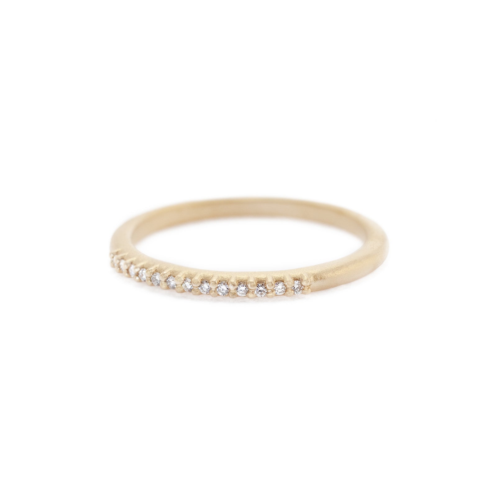 Handmade classic wedding band with pave set diamonds in 18K yellow gold. Perfect stacking band by Designer Megan Thorne