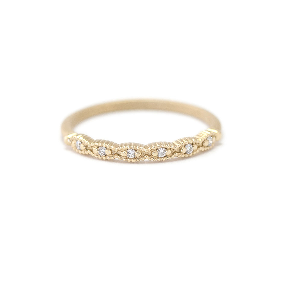Handmade thin wedding band with scalloped ribbing in 18K yellow gold by Designer Megan Thorne