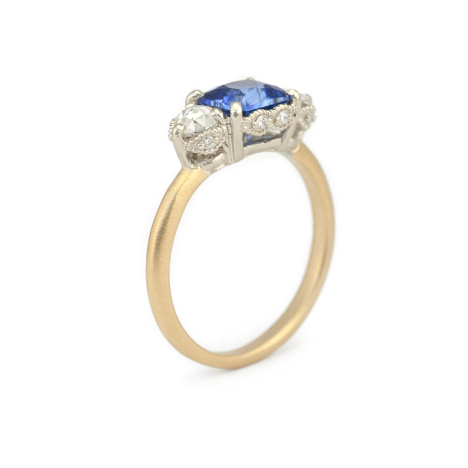 Blue Sapphire and Rose Cut Diamond Two Tone Ring with Detailing Through Finger View