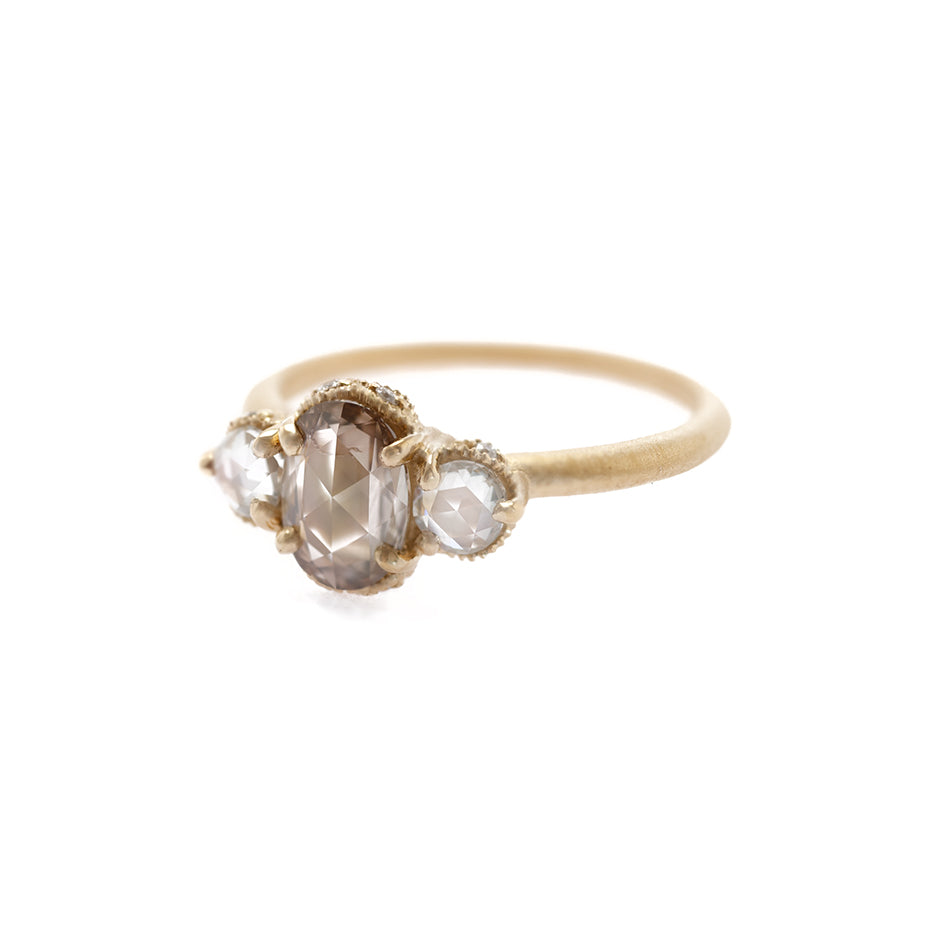Handmade classic 3-stone engagement ring featuring brown champagne diamond and rose cut diamond with ribbed details in 18K yellow gold by Designer Megan Thorne