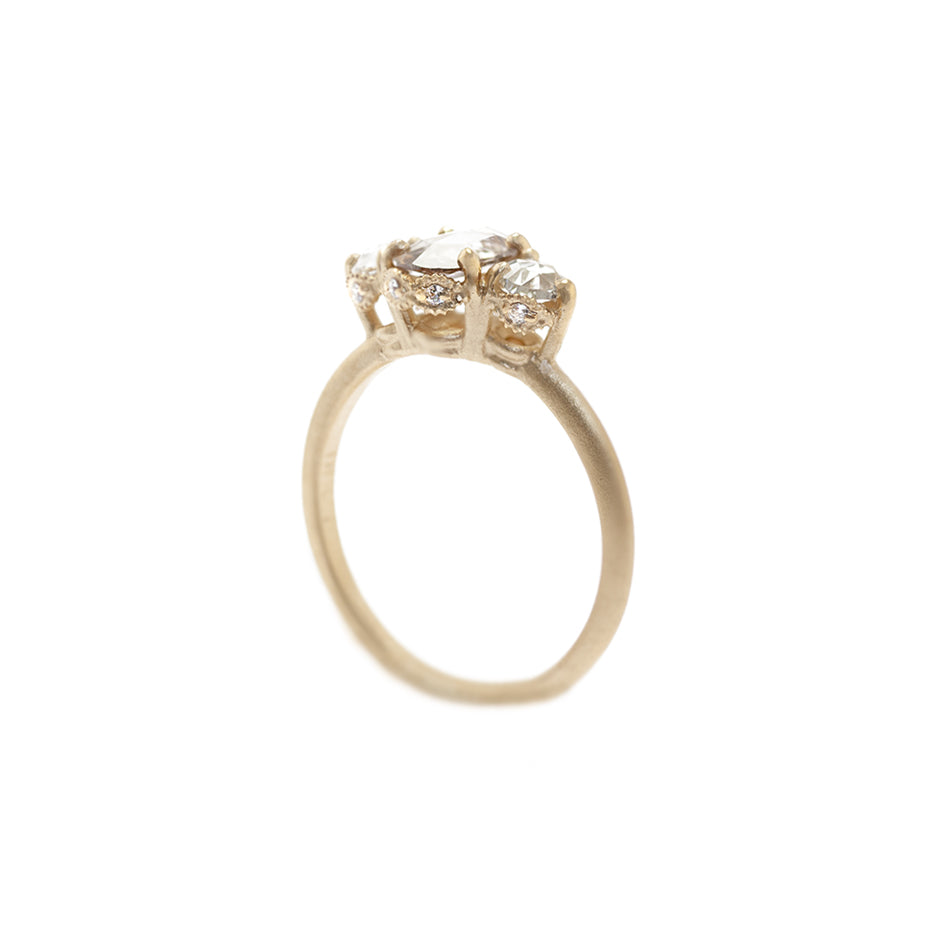 Handmade classic 3-stone engagement ring featuring brown champagne diamond and rose cut diamond with ribbed details in 18K yellow gold by Designer Megan Thorne
