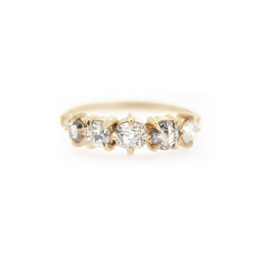 Handmade wedding band with a mix of antique white and salt and pepper diamonds in 18K yellow gold by Designer Megan Thorne