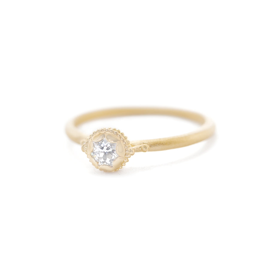 Handmade vintage inspired engagement ring featuring an antique diamond enrobed in 18K yellow gold scallops and ribbing. Classic design by Designer Megan Thorne