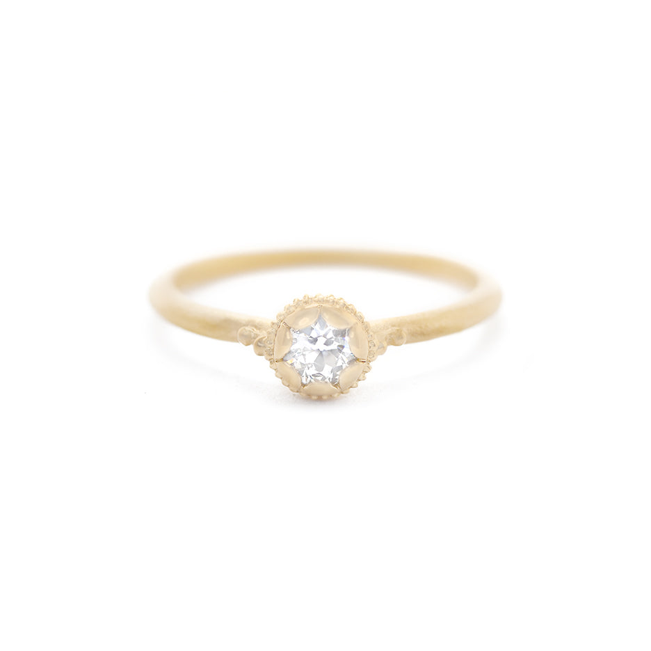 Handmade vintage inspired engagement ring featuring an antique diamond enrobed in 18K yellow gold scallops and ribbing. Classic design by Designer Megan Thorne