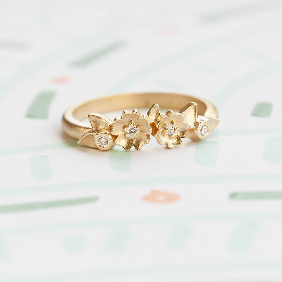Handmade stacking or wedding band with Buttercup flowers, leaves and diamonds in 18K yellow gold by Designer Megan Thorne