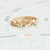 Handmade stacking or wedding band with Buttercup flowers, leaves and diamonds in 18K yellow gold by Designer Megan Thorne