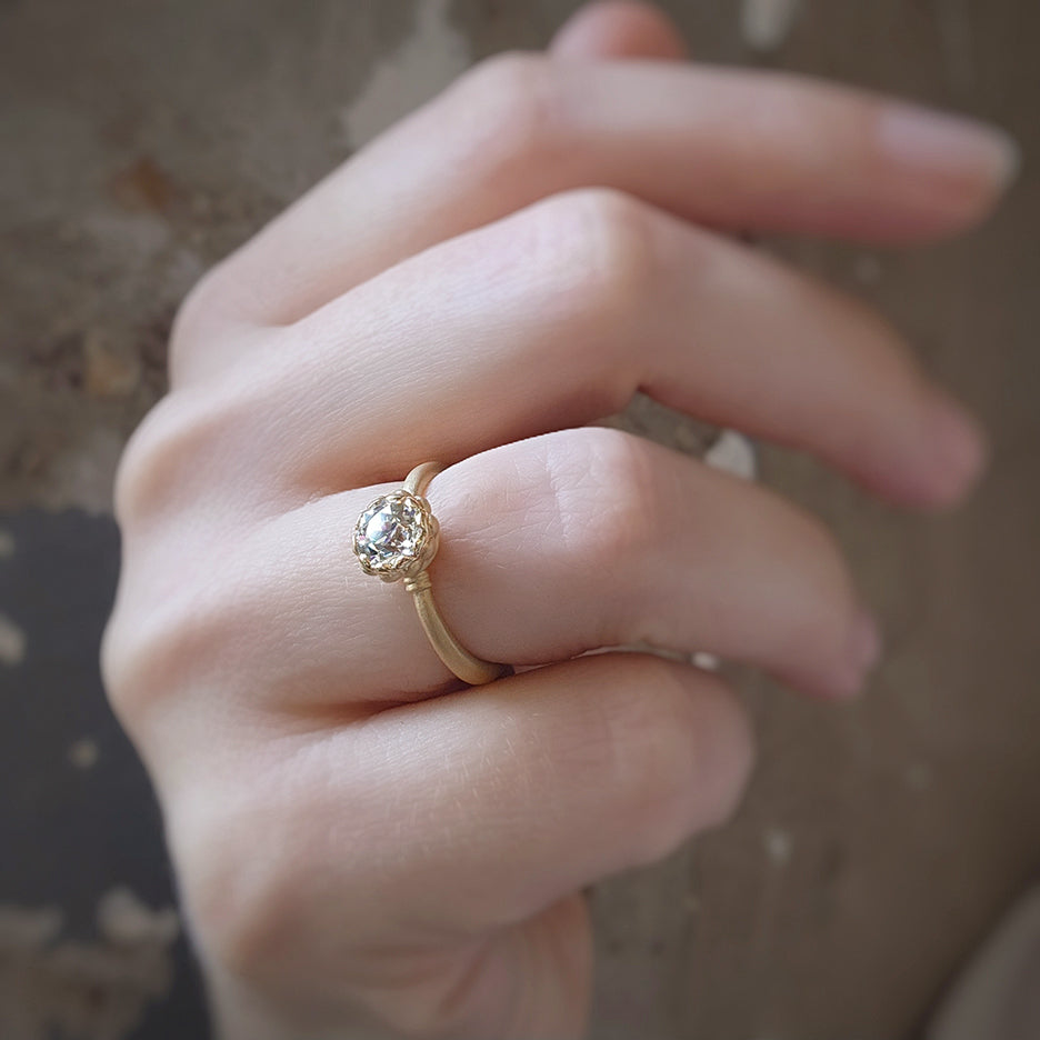 Handmade classic engagement ring with 1ct Old European Cut diamond and vintage inspired scalloped detailing with a striking symmetrical profile in 18K yellow gold by Designer Megan Thorne on hand