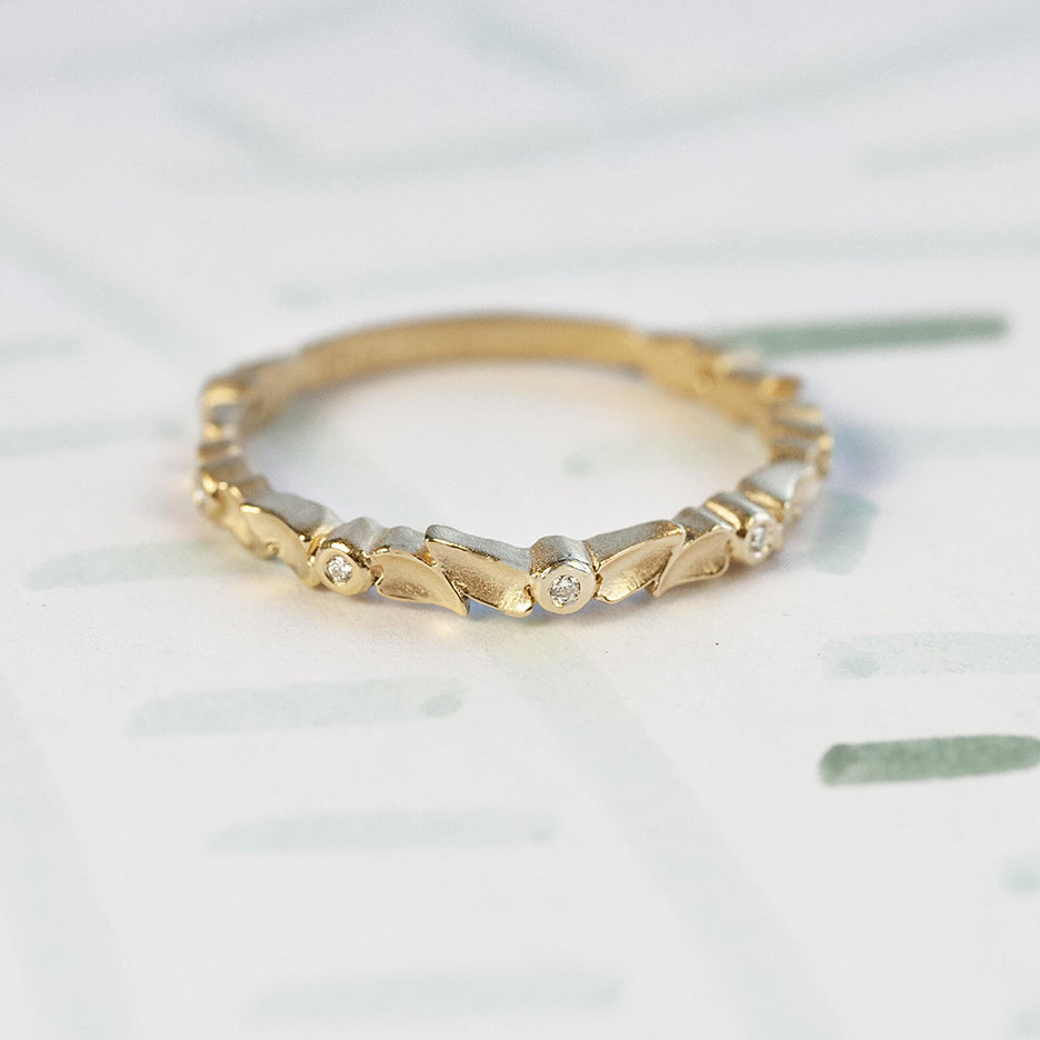 Handmade floral gibbous wedding band with diamonds and petal  details in 18K yellow gold by Designer Megan Thorne