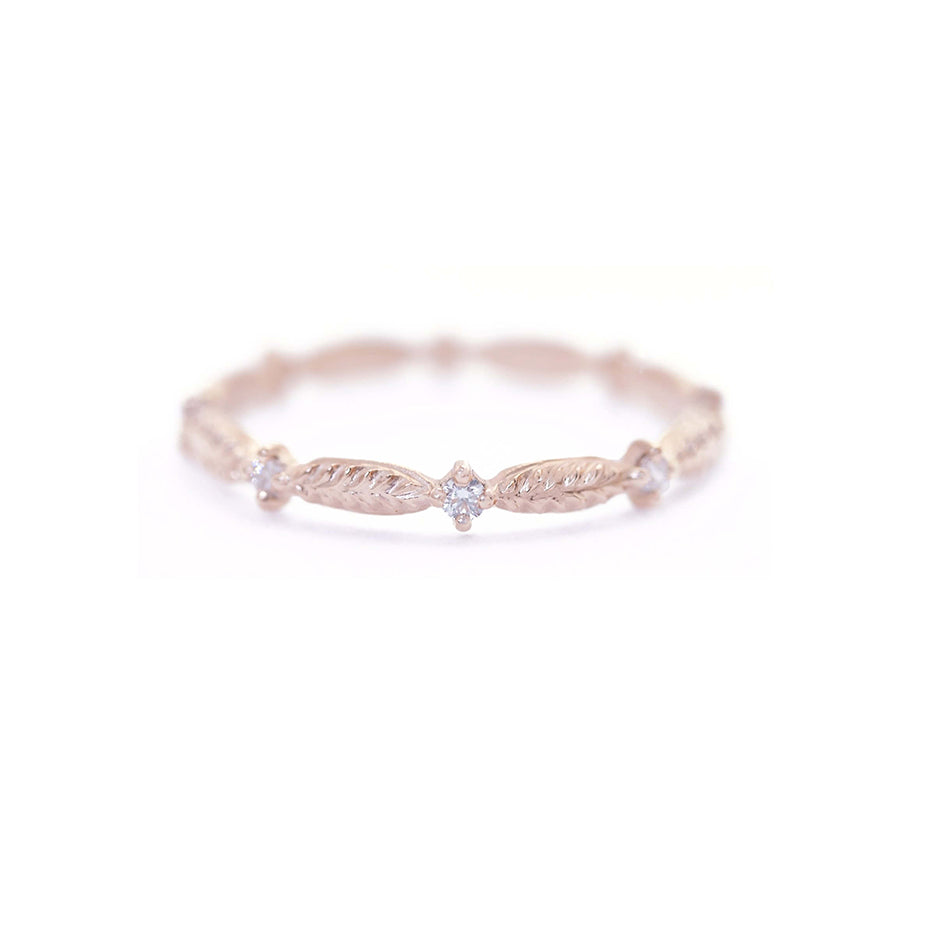 Handmade wedding or stacking band with diamonds and botanical Evergreen details in 18K rose gold by Designer Megan Thorne