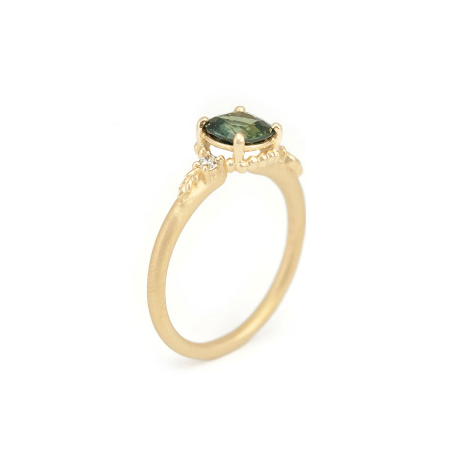 Green Sapphire Engagement Ring in Yellow Gold with Botanical Detail Through Finger View