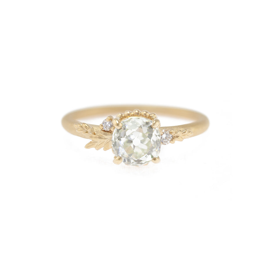 Handmade classic engagement ring featuring fancy color light green-yellow old mine cut diamond and white diamond accent with floral wood nymph details in 18K yellow gold by Designer Megan Thorne