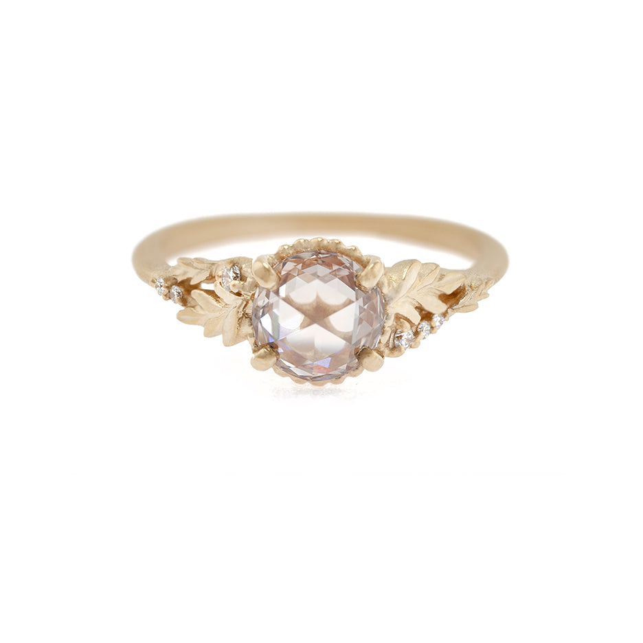 Handmade alternative engagement ring featuring fancy colored pink champagne rose cut diamond and diamond accents with Wood Nymph asymmetrical floral details in 18K yellow gold by Designer Megan Thorne